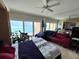Open living space with large windows offering beach views and a comfortable seating area at 880 Mandalay Ave # N311, Clearwater Beach, FL 33767