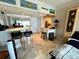 Well-lit living area with a tile floor, open layout, and breakfast bar at 880 Mandalay Ave # N311, Clearwater Beach, FL 33767