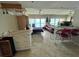 Cozy living area with a pull-down Murphy bed and a breakfast bar overlooking a serene ocean view at 880 Mandalay Ave # N311, Clearwater Beach, FL 33767