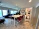 Spacious living area with a large mirrored wall that offers ocean views and natural light at 880 Mandalay Ave # N311, Clearwater Beach, FL 33767