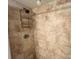 Shower stall with tiled walls and built-in shelving for toiletries at 880 Mandalay Ave # N311, Clearwater Beach, FL 33767