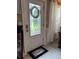 Elegant front door featuring a decorative glass window and a 'Hello' welcome mat at 906 Ponce De Leon Blvd, Belleair, FL 33756