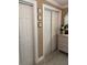 Hallway area showcasing a white dresser, closet, and a decorative mirror for added elegance at 906 Ponce De Leon Blvd, Belleair, FL 33756