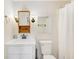 Bathroom with white vanity, toilet, mirrors, new fixtures, and shower curtain at 9790 66Th N St # 37, Pinellas Park, FL 33782