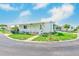 Well-maintained single-story home with a carport and landscaping in a peaceful community setting at 9790 66Th N St # 37, Pinellas Park, FL 33782