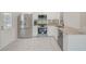 Updated kitchen featuring stainless steel appliances, granite countertops, and stylish white cabinets at 9790 66Th N St # 37, Pinellas Park, FL 33782