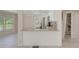 Kitchen island with granite countertop complements the stainless appliances and white cabinetry at 9790 66Th N St # 37, Pinellas Park, FL 33782