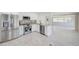 Modern kitchen with stainless steel appliances and granite countertops overlooking the living area at 9790 66Th N St # 37, Pinellas Park, FL 33782