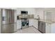 Well-appointed kitchen boasting stainless steel appliances, granite countertops, and ample cabinetry at 9790 66Th N St # 37, Pinellas Park, FL 33782