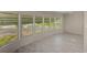 Bright living room with ample natural light with newly installed gray laminate flooring at 9790 66Th N St # 37, Pinellas Park, FL 33782