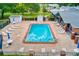 Inviting community pool with lounge chairs and patio furniture for relaxing on sunny days at 9790 66Th N St # 37, Pinellas Park, FL 33782