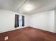 Bedroom featuring a window with curtains and old brown carpet at 9910 Jerome Dr, New Port Richey, FL 34654