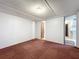 Bedroom featuring a window and door at 9910 Jerome Dr, New Port Richey, FL 34654