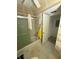 The bathroom features a shower-tub combo with a shower curtain and floral-patterned wallpaper at 102 47Th Avenue W Dr # 136, Bradenton, FL 34207