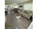 Bright and airy living room with neutral tones, comfortable seating, and a ceiling fan at 102 47Th Avenue W Dr # 136, Bradenton, FL 34207