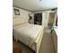 Cozy primary bedroom with plush carpeting and well-lit closet at 102 47Th Avenue W Dr # 136, Bradenton, FL 34207