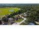 Aerial view showcases homes backing onto green spaces and wooded areas, blending nature with neighborhood charm at 10365 Lynnhaven Rd, Spring Hill, FL 34608