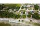 Expansive aerial view showcases waterfront homes amid lush trees and tranquil scenery at 10365 Lynnhaven Rd, Spring Hill, FL 34608