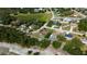 Aerial view showcases homes near a waterfront, blending residential comfort with scenic nature views at 10365 Lynnhaven Rd, Spring Hill, FL 34608