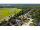 Aerial view highlighting homes with private pools backing onto green spaces and wooded areas at 10365 Lynnhaven Rd, Spring Hill, FL 34608