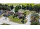 Overhead view of homes with backyard pools, lush landscaping, and serene natural surroundings at 10365 Lynnhaven Rd, Spring Hill, FL 34608