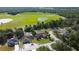 Aerial view highlights homes adjacent to green spaces and ponds, offering serene residential living at 10365 Lynnhaven Rd, Spring Hill, FL 34608
