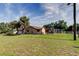 Spacious backyard with a screened-in porch, perfect for outdoor relaxation and entertainment at 10365 Lynnhaven Rd, Spring Hill, FL 34608