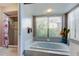 Bathroom featuring a bathtub, a shower with glass enclosure, and natural light at 10365 Lynnhaven Rd, Spring Hill, FL 34608