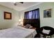 Bedroom features include neutral paint and a dark wood-framed headboard and matching chair at 10365 Lynnhaven Rd, Spring Hill, FL 34608
