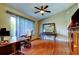 Inviting home office with hardwood floors, natural light, and a ceiling fan at 10365 Lynnhaven Rd, Spring Hill, FL 34608