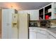 Traditional kitchen featuring white cabinetry, stainless steel appliances, and ample counter space at 10365 Lynnhaven Rd, Spring Hill, FL 34608