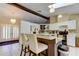 Open kitchen with counter seating, modern lighting, and stylish decor at 10365 Lynnhaven Rd, Spring Hill, FL 34608
