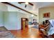 Open concept living space featuring hardwood floors and an adjacent living room at 10365 Lynnhaven Rd, Spring Hill, FL 34608