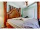 Main bedroom featuring a statement canopy bed and calming decor for a serene retreat at 10365 Lynnhaven Rd, Spring Hill, FL 34608