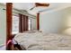 Main bedroom with a view of the backyard pool, ceiling fan and lots of natural light at 10365 Lynnhaven Rd, Spring Hill, FL 34608