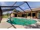 Screened-in pool area with spacious patio, ideal for outdoor relaxation and entertaining at 10365 Lynnhaven Rd, Spring Hill, FL 34608