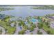 Aerial view of a resort-style community pool with a lake in the background at 10830 Verawood Dr, Riverview, FL 33579