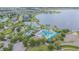 Aerial view of a resort-style community pool with a lake in the background at 10830 Verawood Dr, Riverview, FL 33579