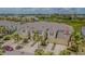 This beautiful townhome has a two-car garage, brick-paved driveway, and tropical landscaping at 10830 Verawood Dr, Riverview, FL 33579