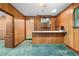 Retro bar featuring a bar counter, shelving, and access to other living areas at 11159 Cindy Dr, Brooksville, FL 34601