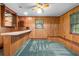 Retro bar area with counter seating, shelving, and window at 11159 Cindy Dr, Brooksville, FL 34601