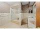 Bathroom with tile, shower, and double vanity sinks at 11159 Cindy Dr, Brooksville, FL 34601