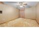 Cozy bedroom featuring light carpet, wallpaper, and a window at 11159 Cindy Dr, Brooksville, FL 34601