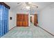 Bedroom with wood closet doors and ensuite entrance at 11159 Cindy Dr, Brooksville, FL 34601