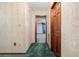 Hallway with patterned wallpaper leading to bedroom at 11159 Cindy Dr, Brooksville, FL 34601