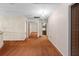 Hallway with view of bathroom and bedroom, brown carpet, and closet doors with mirrors at 11159 Cindy Dr, Brooksville, FL 34601