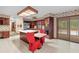 Bright kitchen with stainless steel appliances, an island, and access to the outdoor pool at 11159 Cindy Dr, Brooksville, FL 34601