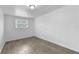 Cozy bedroom featuring wood-look floors and one window at 1116 Jadewood Ave, Clearwater, FL 33759