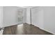 Bright bedroom with a closet, wood floors, a window with blinds, and neutral wall paint at 1116 Jadewood Ave, Clearwater, FL 33759