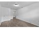 Wood-look floors and a bright neutral paint enhance this bedroom at 1116 Jadewood Ave, Clearwater, FL 33759